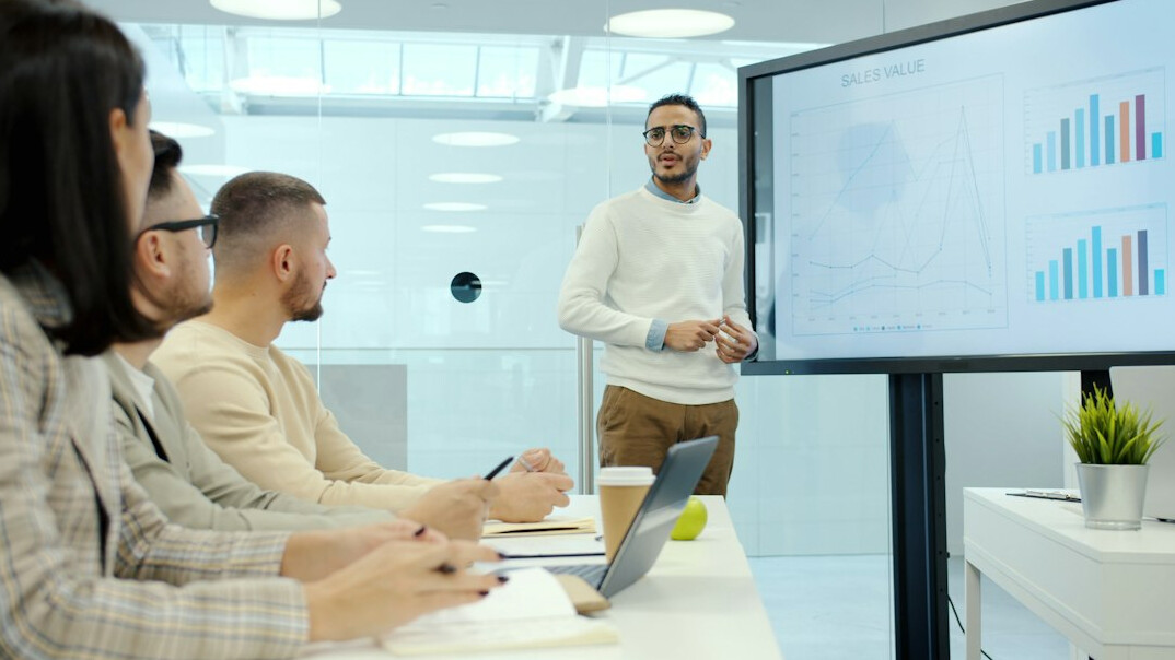 man presenting in business meeting