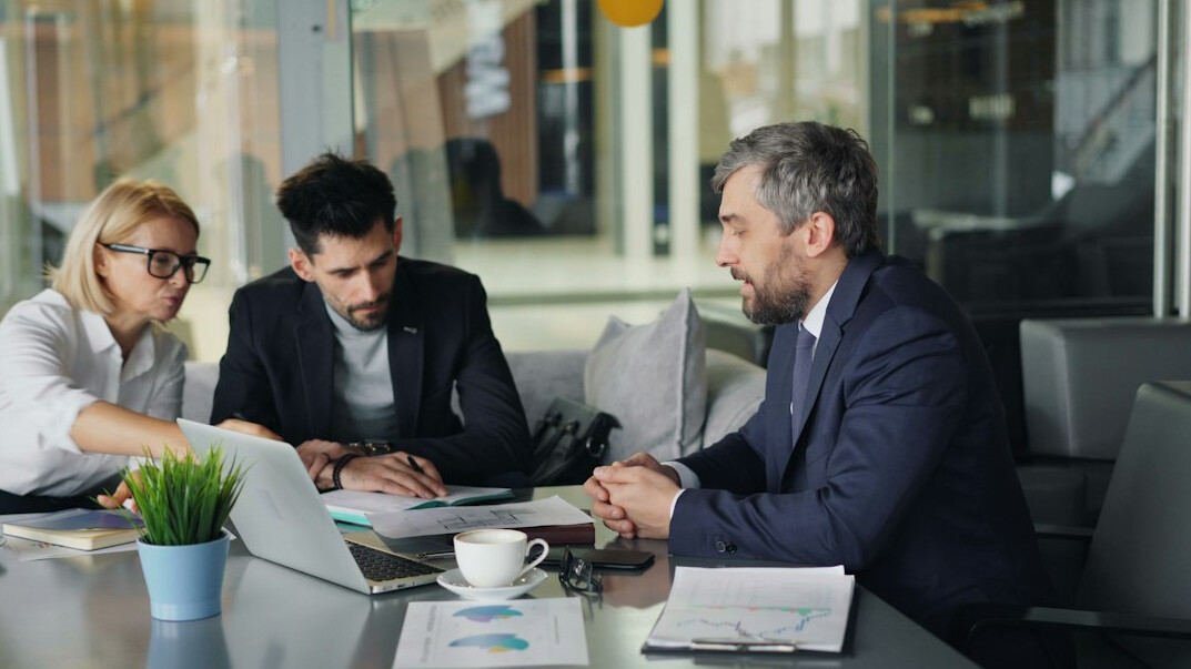 business people negotiating table