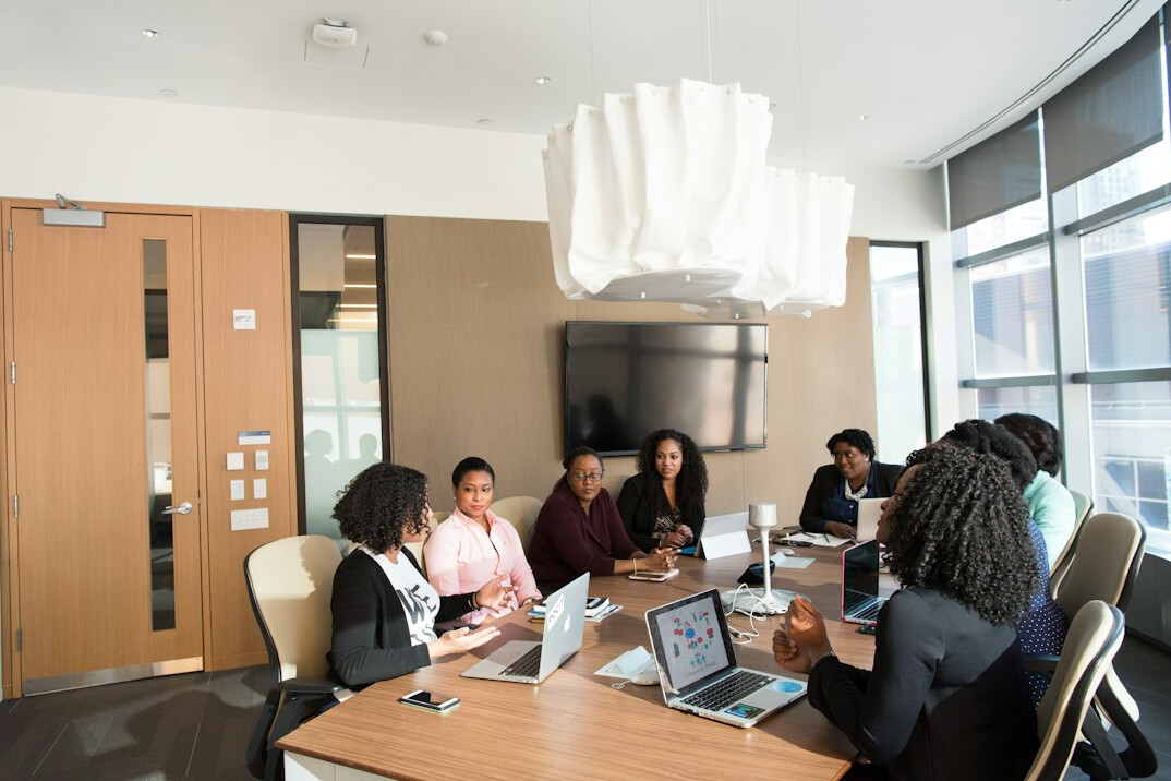 woman leading business meeting
