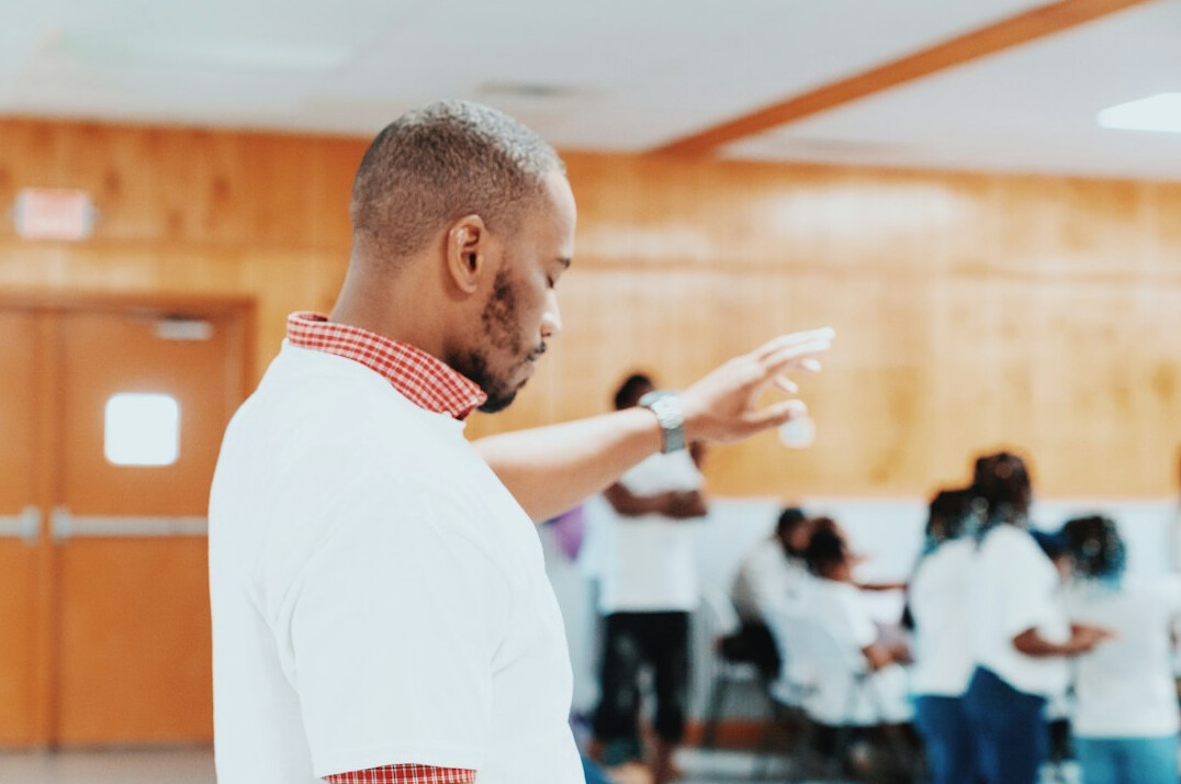 man presenting to group